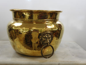 Brass pot belly planter with lions head handles