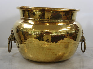 Brass pot belly planter with lions head handles