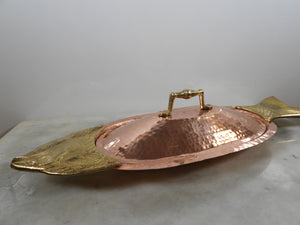 Handmade copper fish shaped lidded serving dish with brass accents and hammered texture
